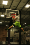 Boy Jumping to Score a Basket